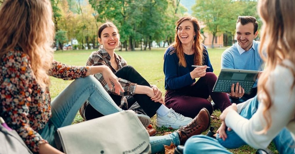Students on a semester abroad study together in nature